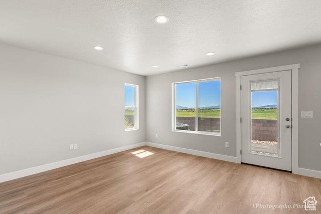 535 W 2530 N Unit 6-10, Cedar City, UT 84721 - unfurnished room featuring light wood-style floors, baseboards, recessed lighting, and a textured ceiling