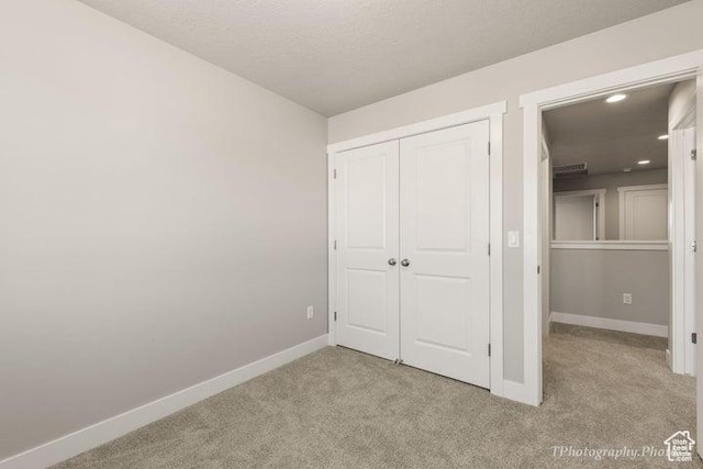 535 W 2530 N Unit 6-10, Cedar City, UT 84721 - unfurnished bedroom featuring light colored carpet, baseboards, a closet, and recessed lighting