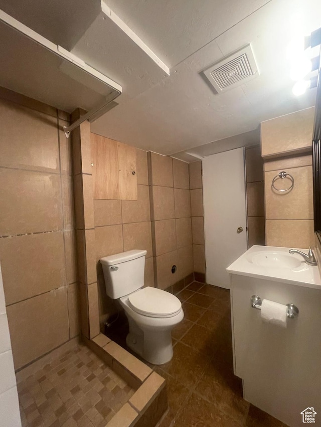 5890 S 2625 W, Roy, UT 84067 - bathroom featuring toilet, vanity, tile walls, and tile patterned floors