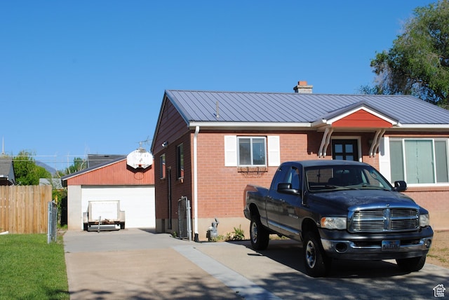 5890 S 2625 W, Roy, UT 84067 - single story home featuring brick siding, a chimney, a garage, and metal roof