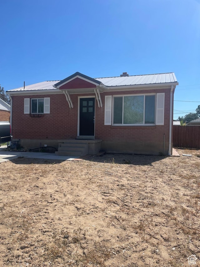 5890 S 2625 W, Roy, UT 84067 - ranch-style house with brick siding, metal roof, and heating fuel