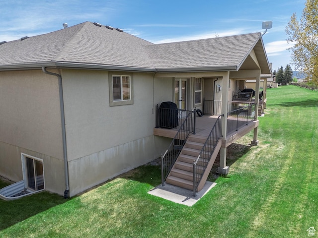 2029 S Cottage Ln, Garden City, UT 84028 - rear view of property with a shingled roof, a yard, and stucco siding