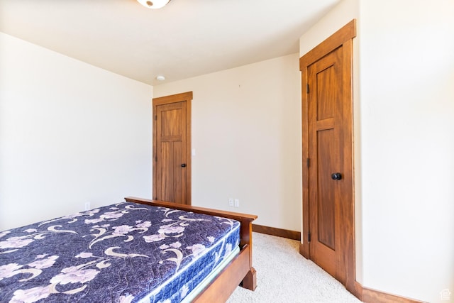 2029 S Cottage Ln, Garden City, UT 84028 - bedroom featuring light carpet and baseboards