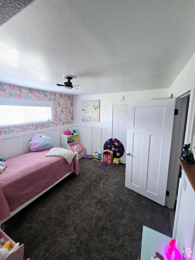 1191 N Geneva Rd, Provo, UT 84601 - carpeted bedroom featuring wainscoting, a textured ceiling, wallpapered walls, and a ceiling fan