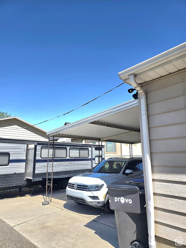 1191 N Geneva Rd, Provo, UT 84601 - view of parking / parking lot featuring a carport
