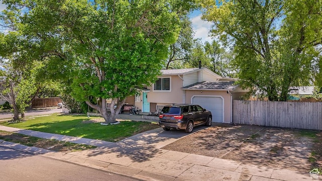 3631 W 7910 S, West Jordan, UT 84088 - view of front facade featuring a garage, driveway, and stucco siding