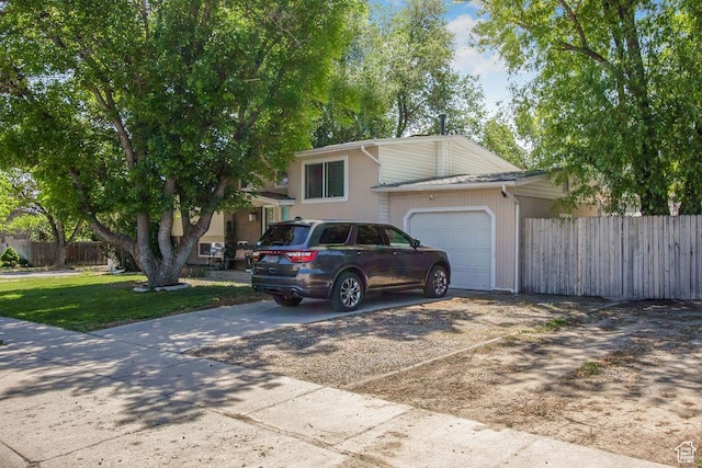 3631 W 7910 S, West Jordan, UT 84088 - split level home with concrete driveway and an attached garage