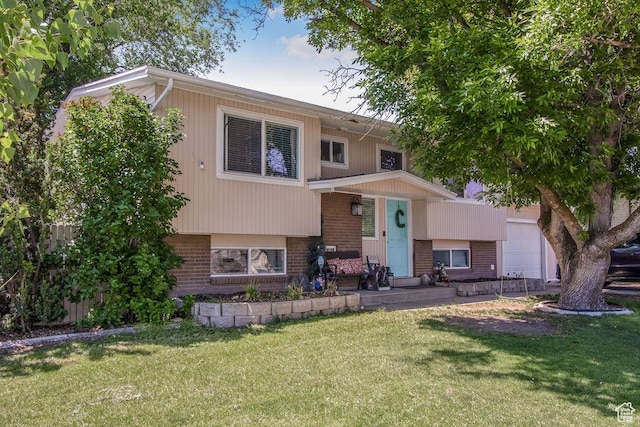 3631 W 7910 S, West Jordan, UT 84088 - view of front of home featuring brick siding, a front yard, and a porch