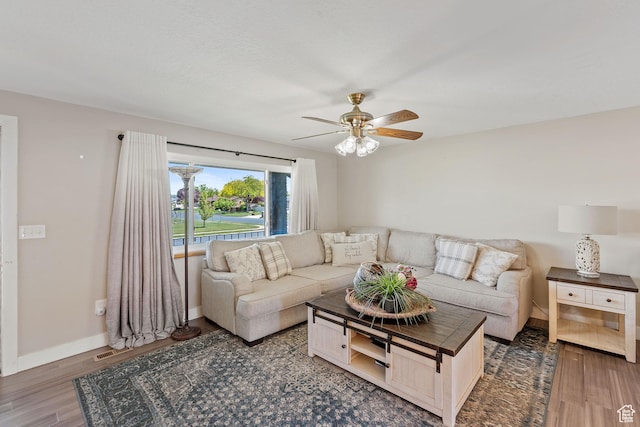 1265 W 1625 S, Syracuse, UT 84075 - living room with ceiling fan, wood finished floors, and baseboards