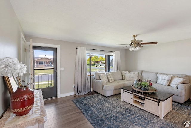 1265 W 1625 S, Syracuse, UT 84075 - living area featuring wood finished floors, a ceiling fan, and baseboards
