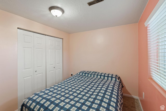 1265 W 1625 S, Syracuse, UT 84075 - carpeted bedroom with a textured ceiling, a closet, and baseboards