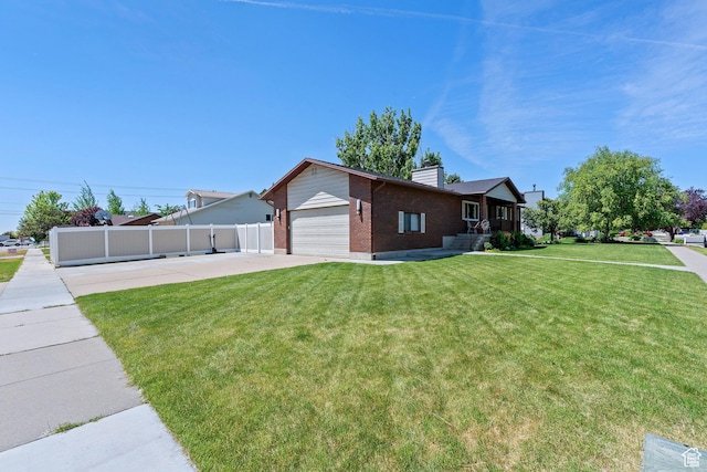 1265 W 1625 S, Syracuse, UT 84075 - view of front of home featuring brick siding, a chimney, and concrete driveway