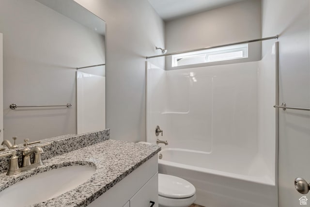 5452 N Orville St Unit 411, Eagle Mountain, UT 84005 - bathroom featuring vanity, toilet, and washtub / shower combination