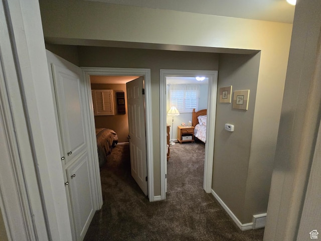 1549 W Marty Cir W, West Jordan, UT 84084 - corridor featuring dark carpet and baseboards