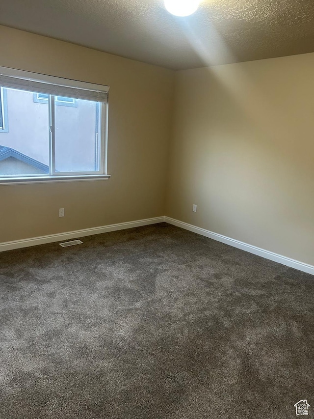 4673 W Greensand Dr, West Jordan, UT 84084 - spare room featuring dark carpet and baseboards