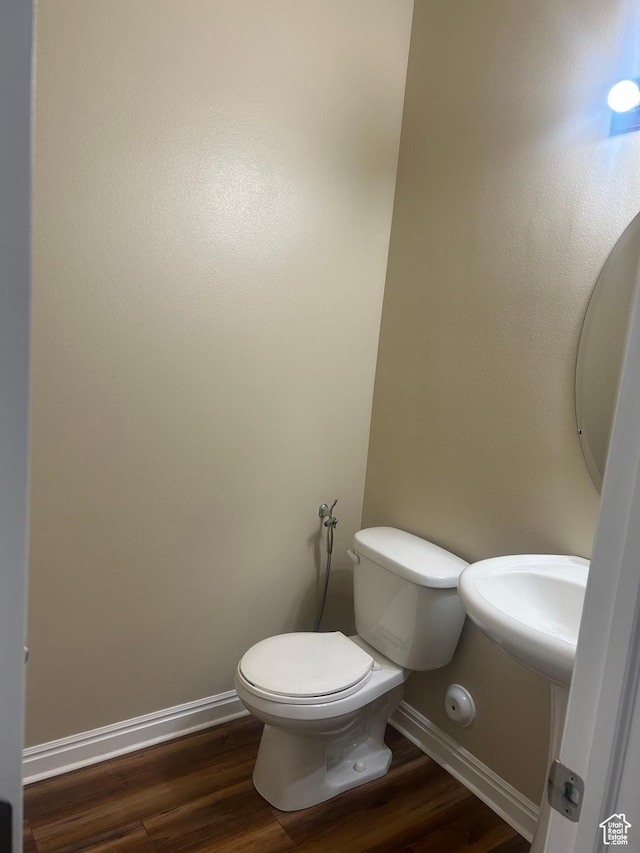 4673 W Greensand Dr, West Jordan, UT 84084 - bathroom with toilet, wood finished floors, and baseboards