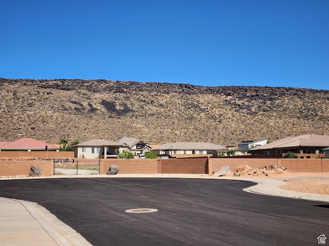 3288 W 2570 S, Hurricane, UT 84737 - view of asphalt street with a mountain view and curbs