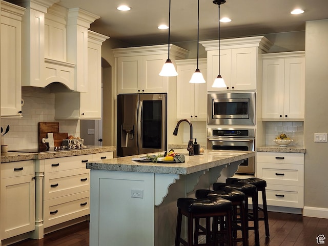3288 W 2570 S, Hurricane, UT 84737 - kitchen with appliances with stainless steel finishes, dark wood-style flooring, white cabinetry, backsplash, and recessed lighting