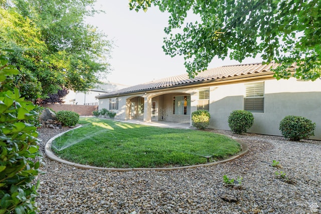 3288 W 2570 S, Hurricane, UT 84737 - rear view of house featuring stucco siding, a tiled roof, and a patio