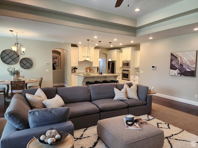 3288 W 2570 S, Hurricane, UT 84737 - living room featuring arched walkways, baseboards, recessed lighting, a ceiling fan, and dark wood finished floors