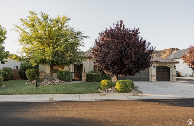 3288 W 2570 S, Hurricane, UT 84737 - obstructed view of property featuring stone siding, stucco siding, and a front lawn