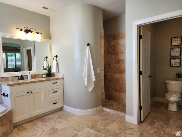 3288 W 2570 S, Hurricane, UT 84737 - bathroom featuring vanity, a walk in shower, baseboards, and toilet