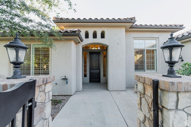 3288 W 2570 S, Hurricane, UT 84737 - property entrance with stucco siding and a tile roof
