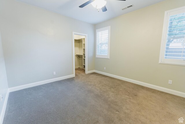 3288 W 2570 S, Hurricane, UT 84737 - unfurnished bedroom with carpet, baseboards, a spacious closet, a closet, and a ceiling fan