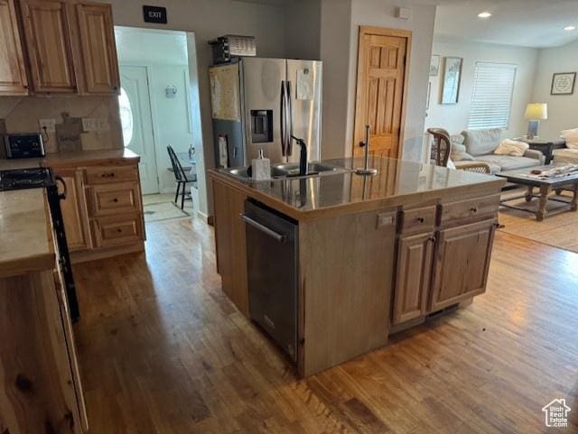 345 N 1st E, Manila, UT 84046 - kitchen with dishwasher, stainless steel fridge, light wood-style floors, open floor plan, and a sink