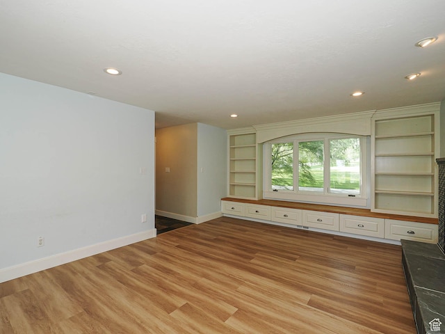 919 E 13800 S, Draper, UT 84020 - unfurnished living room featuring baseboards, light wood-style flooring, built in features, and recessed lighting