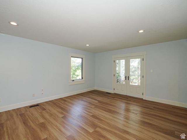 919 E 13800 S, Draper, UT 84020 - empty room with baseboards, recessed lighting, light wood-style flooring, and french doors