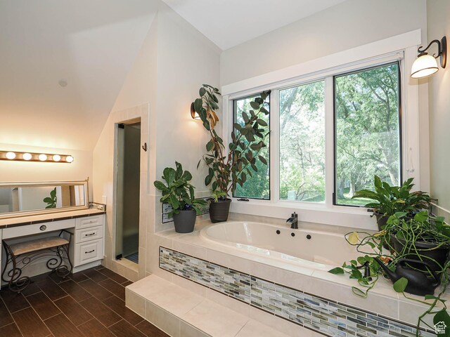 919 E 13800 S, Draper, UT 84020 - bathroom featuring a garden tub, vanity, lofted ceiling, a shower stall, and wood finished floors