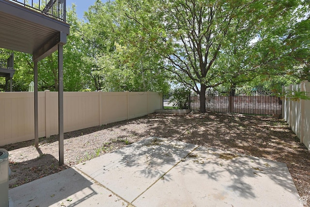 7198 S Milky Hollow Ln, West Jordan, UT 84084 - fenced backyard with a patio