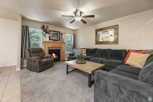 7198 S Milky Hollow Ln, West Jordan, UT 84084 - living area with ceiling fan, a fireplace with flush hearth, healthy amount of natural light, and light tile patterned floors