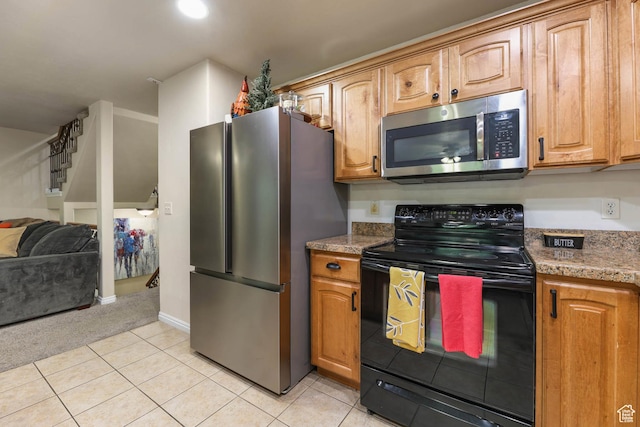 7198 S Milky Hollow Ln, West Jordan, UT 84084 - kitchen with appliances with stainless steel finishes, open floor plan, light tile patterned floors, and brown cabinets