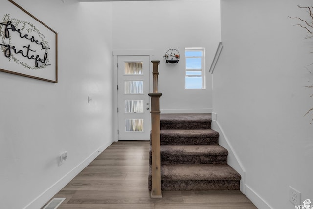 7217 N Hidden Steppe Bnd, Eagle Mountain, UT 84005 - stairs featuring wood finished floors and baseboards