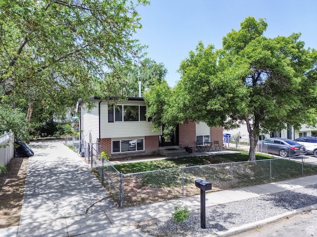 4206 S Whipoorwhil St W, West Valley City, UT 84120 - view of front facade featuring brick siding