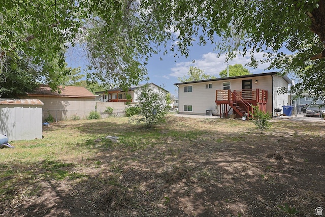 4206 S Whipoorwhil St W, West Valley City, UT 84120 - view of yard with stairs and a wooden deck