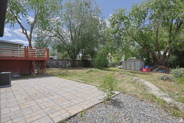4206 S Whipoorwhil St W, West Valley City, UT 84120 - fenced backyard featuring a patio and a wooden deck