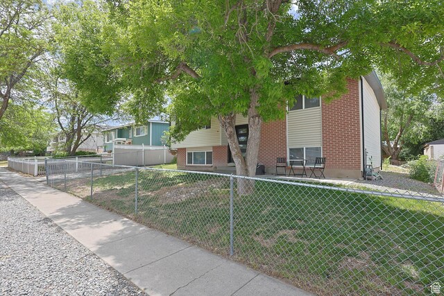 4206 S Whipoorwhil St W, West Valley City, UT 84120 - view of front of property with a fenced front yard
