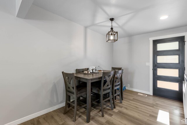 4206 S Whipoorwhil St W, West Valley City, UT 84120 - dining space with baseboards, wood finished floors, and recessed lighting