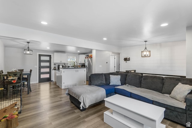 4206 S Whipoorwhil St W, West Valley City, UT 84120 - living room with wood finished floors and recessed lighting