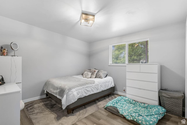 4206 S Whipoorwhil St W, West Valley City, UT 84120 - bedroom featuring wood finished floors and baseboards
