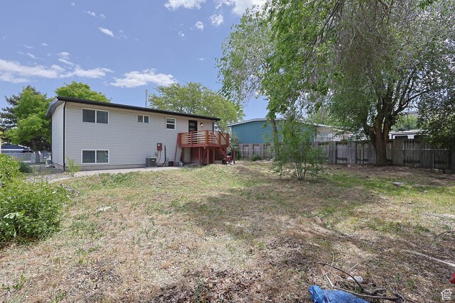 4206 S Whipoorwhil St W, West Valley City, UT 84120 - back of house with a wooden deck and central air condition unit