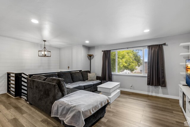 4206 S Whipoorwhil St W, West Valley City, UT 84120 - living room featuring a chandelier, wood finished floors, recessed lighting, and baseboards