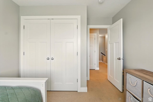 2986 S Stonebridge Dr W, Nibley, UT 84321 - bedroom with light carpet, a closet, and baseboards