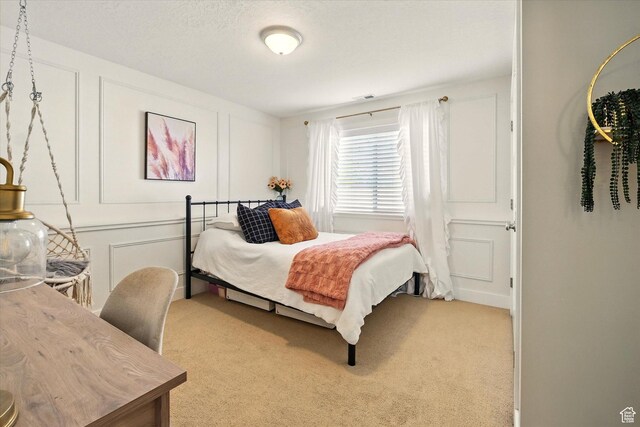 2986 S Stonebridge Dr W, Nibley, UT 84321 - carpeted bedroom featuring a decorative wall