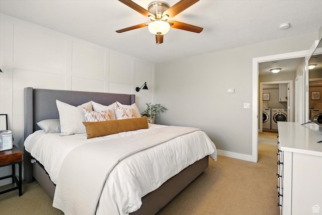 2986 S Stonebridge Dr W, Nibley, UT 84321 - bedroom with washing machine and dryer, light carpet, and a ceiling fan