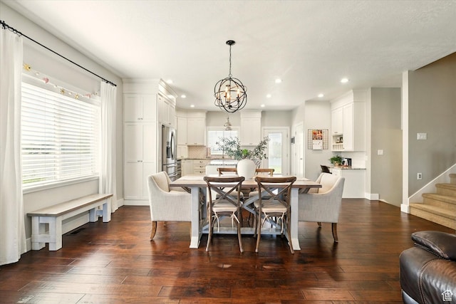 2986 S Stonebridge Dr W, Nibley, UT 84321 - dining space featuring a chandelier, recessed lighting, dark wood-style flooring, stairway, and baseboards