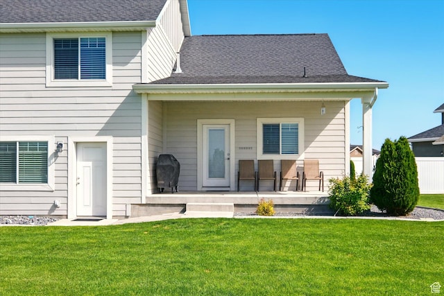 2986 S Stonebridge Dr W, Nibley, UT 84321 - rear view of house with a lawn and roof with shingles